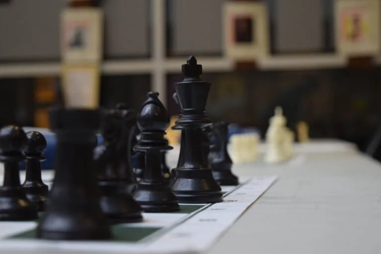 Find out the essential gear you need for a chess tournament, from chess clocks to scorebooks, ensuring you're fully prepared.